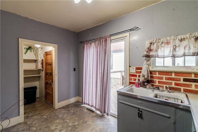 1134 Atchison St, Atchison, KS 66002 - kitchen with gray cabinetry and a sink