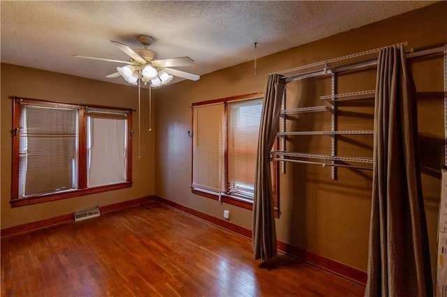 1134 Atchison St, Atchison, KS 66002 - unfurnished bedroom featuring wood finished floors and a textured ceiling