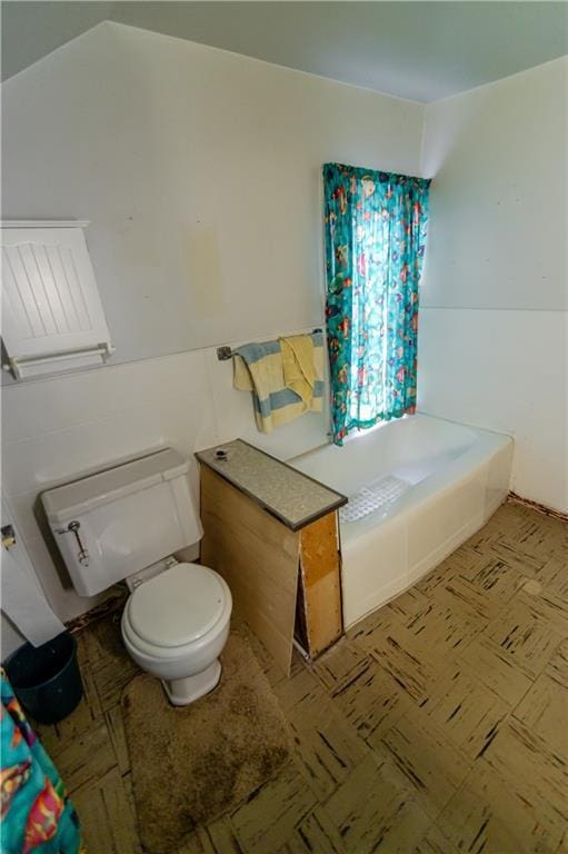 1134 Atchison St, Atchison, KS 66002 - bathroom featuring a tub to relax in and tile patterned floors