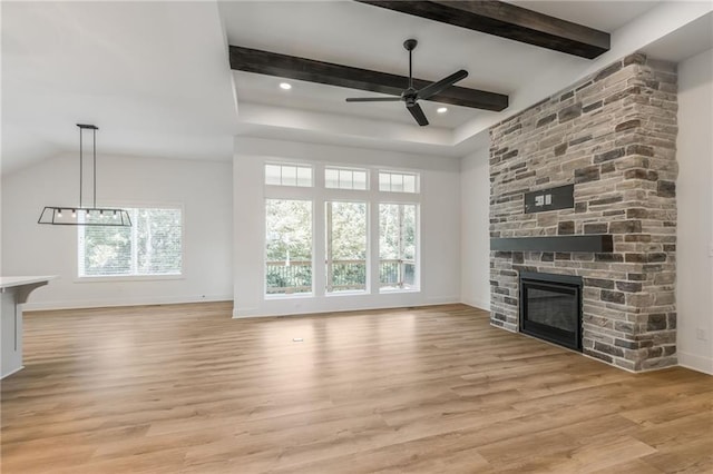 13491 Terrace Park Dr, Parkville, MO 64152 - unfurnished living room featuring a stone fireplace, a ceiling fan, light wood-style flooring, beamed ceiling, and a chandelier