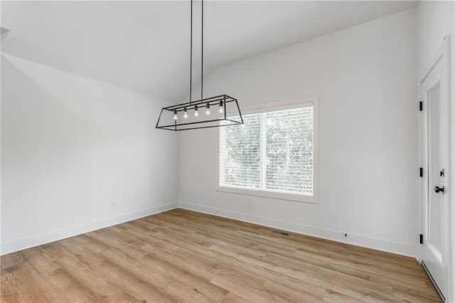 13491 Terrace Park Dr, Parkville, MO 64152 - unfurnished dining area featuring light wood-type flooring and baseboards