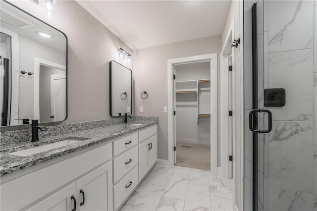 13491 Terrace Park Dr, Parkville, MO 64152 - bathroom featuring marble finish floors, double vanity, a shower stall, and a walk in closet