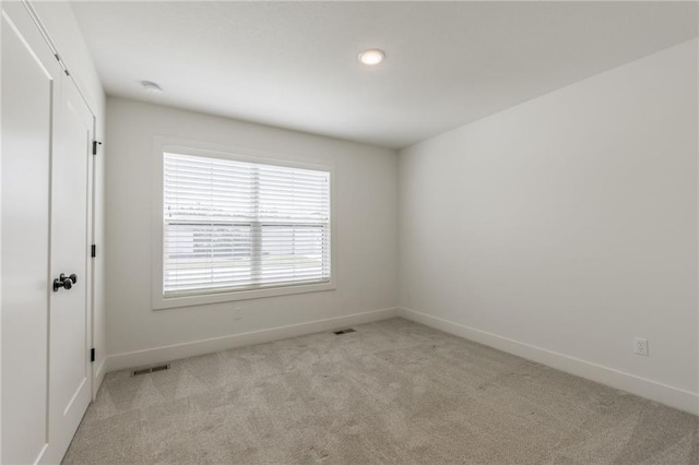 13491 Terrace Park Dr, Parkville, MO 64152 - unfurnished room featuring light carpet and recessed lighting