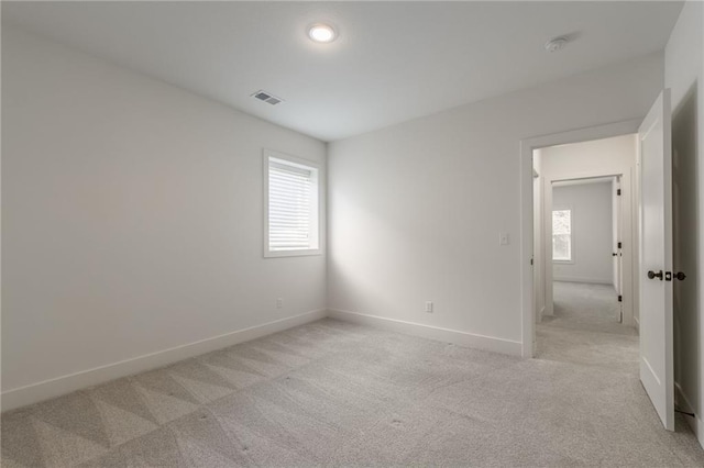 13491 Terrace Park Dr, Parkville, MO 64152 - empty room featuring plenty of natural light, light carpet, and a smoke detector