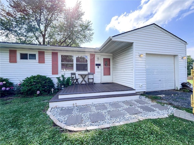 701 N Godfrey St, Cameron, MO 64429 - ranch-style home with a front lawn, a deck, and an attached garage