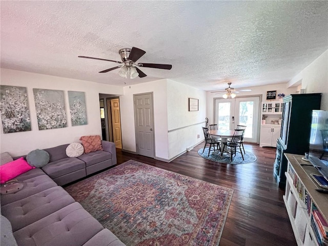 701 N Godfrey St, Cameron, MO 64429 - living room with a ceiling fan, a textured ceiling, and dark wood finished floors