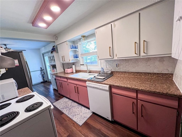 701 N Godfrey St, Cameron, MO 64429 - kitchen featuring white appliances, dark wood-type flooring, tasteful backsplash, and white cabinets