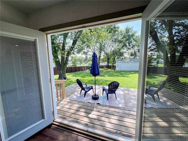 701 N Godfrey St, Cameron, MO 64429 - wooden deck with a fenced backyard and a storage shed