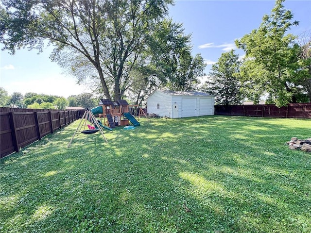 701 N Godfrey St, Cameron, MO 64429 - fenced backyard featuring a playground, a shed, and a garage