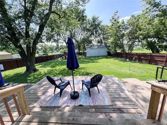 701 N Godfrey St, Cameron, MO 64429 - deck featuring a fenced backyard and a storage unit