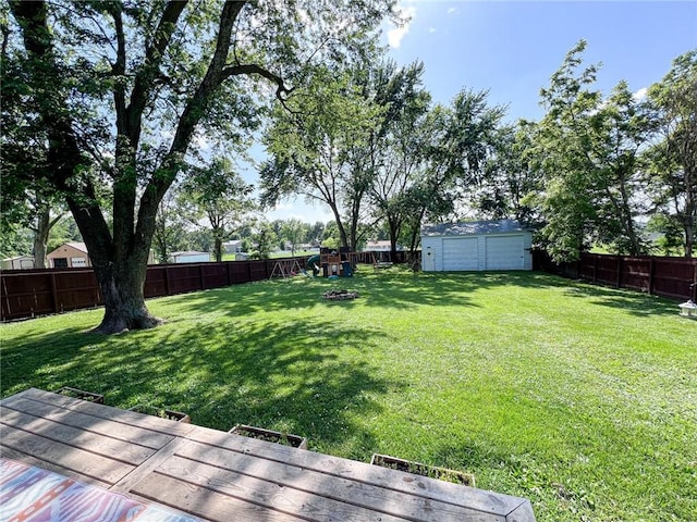 701 N Godfrey St, Cameron, MO 64429 - fenced backyard with a garage and a storage unit