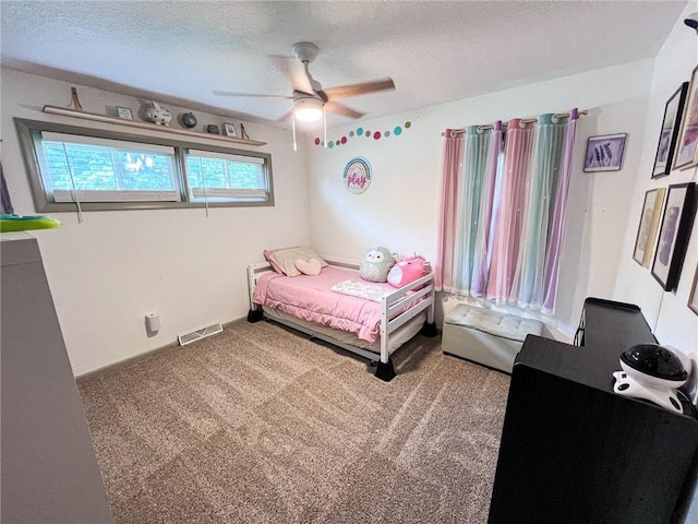 701 N Godfrey St, Cameron, MO 64429 - bedroom featuring carpet flooring, a textured ceiling, and a ceiling fan