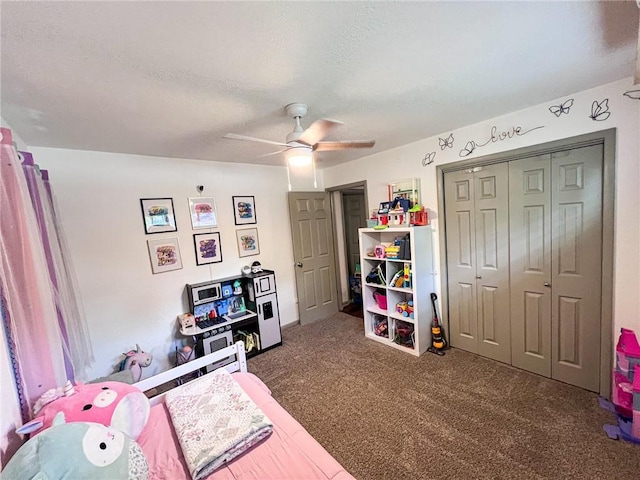 701 N Godfrey St, Cameron, MO 64429 - bedroom with carpet, a closet, ceiling fan, and a textured ceiling