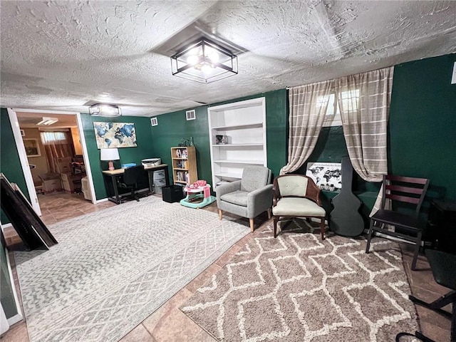 701 N Godfrey St, Cameron, MO 64429 - bedroom featuring a desk, a textured ceiling, and connected bathroom