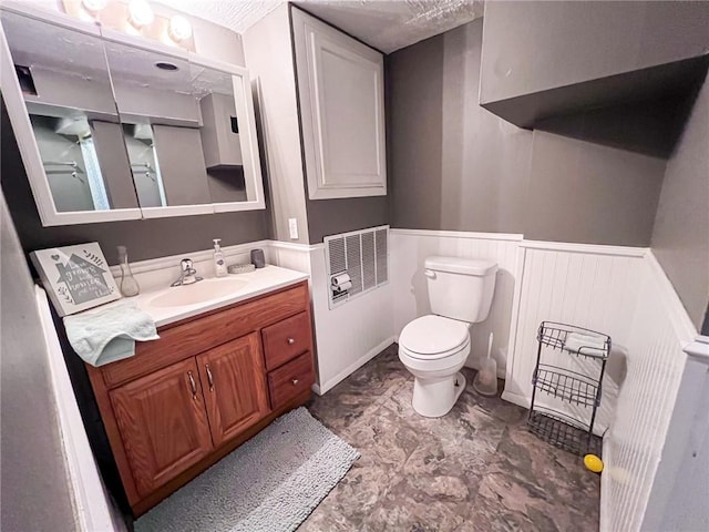 701 N Godfrey St, Cameron, MO 64429 - bathroom featuring vanity and wainscoting