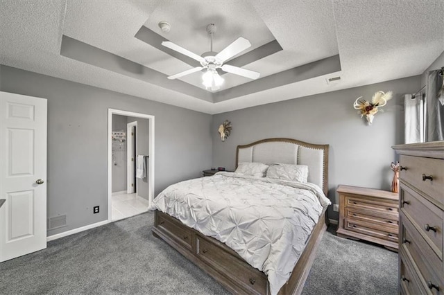 16122 W 157th St, Olathe, KS 66062 - bedroom featuring carpet flooring, a raised ceiling, a textured ceiling, a ceiling fan, and ensuite bathroom