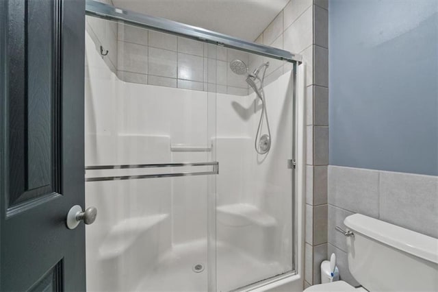 16122 W 157th St, Olathe, KS 66062 - bathroom with tile walls and a shower stall