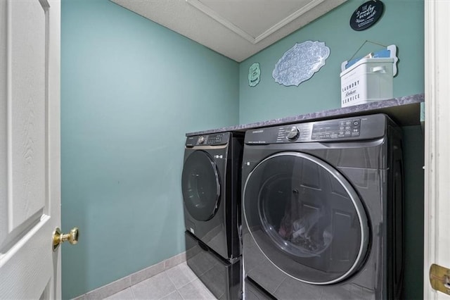 16122 W 157th St, Olathe, KS 66062 - laundry area with washing machine and clothes dryer and tile patterned flooring