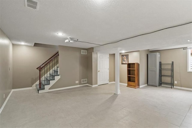 16122 W 157th St, Olathe, KS 66062 - finished basement featuring a textured ceiling, stairs, and recessed lighting