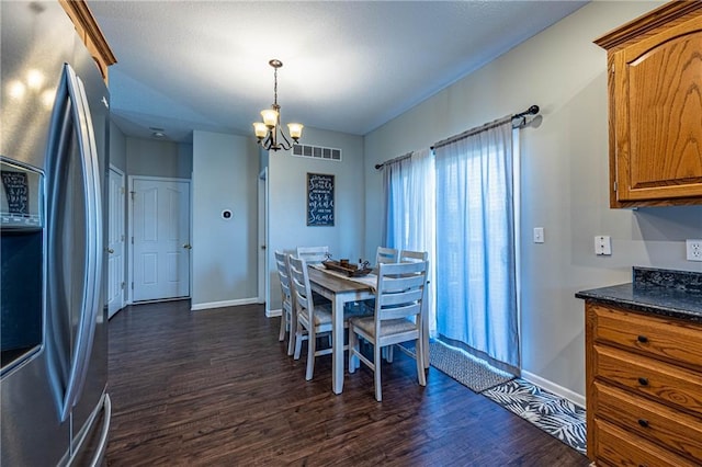 61 SW 446th Rd, Clinton, MO 64735 - dining room with dark wood-style floors and a chandelier