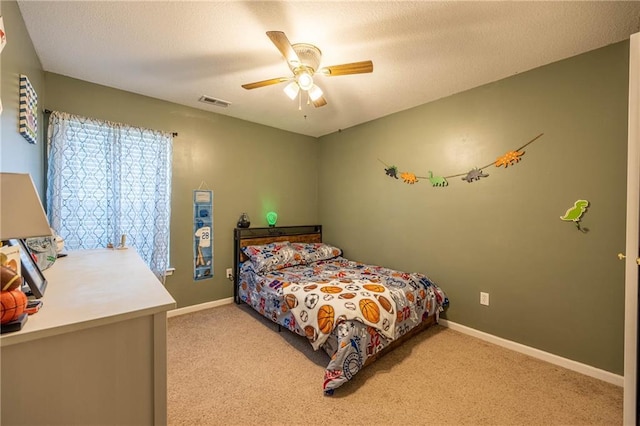 61 SW 446th Rd, Clinton, MO 64735 - carpeted bedroom with ceiling fan and baseboards
