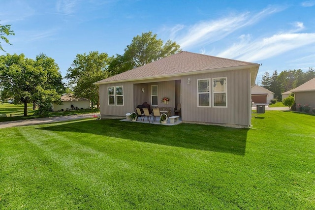 2214 SW 9th St, Blue Springs, MO 64014 - rear view of property with a yard and a patio