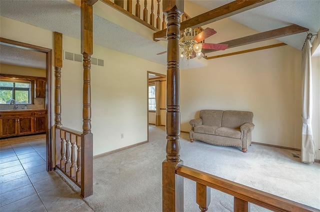 16327 W Locust St, Olathe, KS 66062 - living area featuring a ceiling fan, a textured ceiling, and carpet flooring