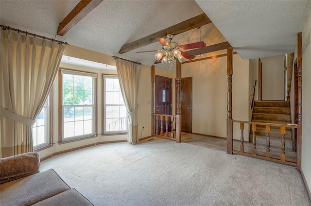 16327 W Locust St, Olathe, KS 66062 - unfurnished living room with a textured ceiling, carpet floors, ceiling fan, and stairway