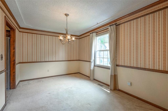 16327 W Locust St, Olathe, KS 66062 - spare room featuring a chandelier, carpet flooring, a textured ceiling, wallpapered walls, and ornamental molding
