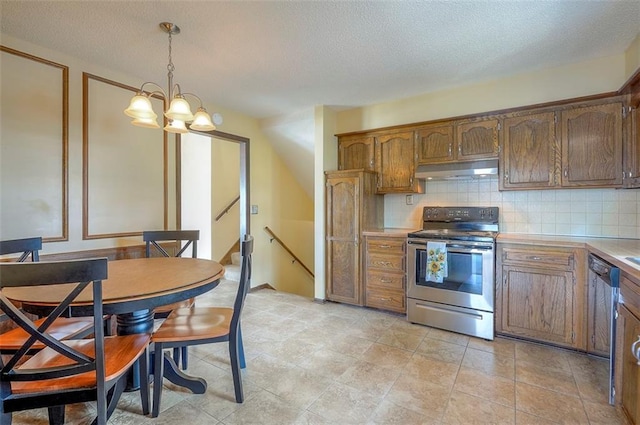 16327 W Locust St, Olathe, KS 66062 - kitchen featuring stainless steel appliances, under cabinet range hood, backsplash, light countertops, and a textured ceiling