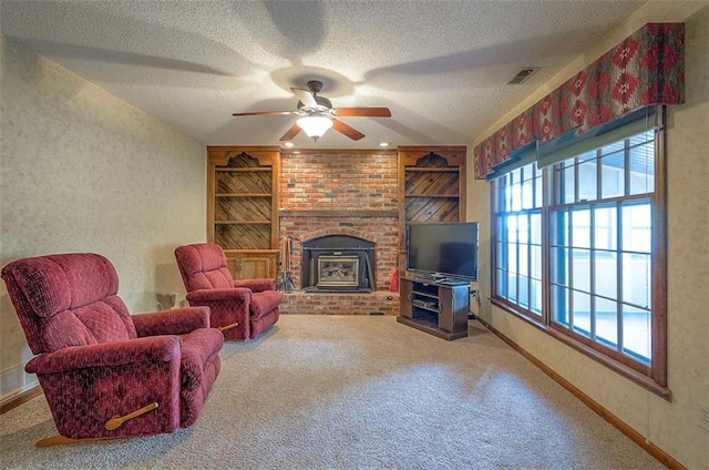 16327 W Locust St, Olathe, KS 66062 - carpeted living area with plenty of natural light, ceiling fan, a textured ceiling, built in features, and a brick fireplace