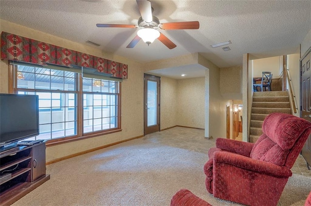 16327 W Locust St, Olathe, KS 66062 - sitting room with carpet flooring, stairway, a textured ceiling, and ceiling fan
