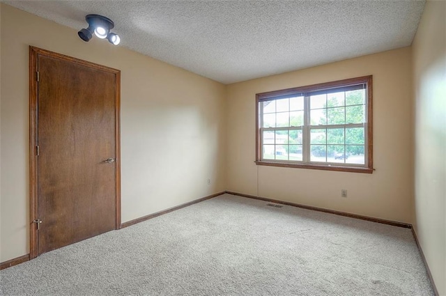 16327 W Locust St, Olathe, KS 66062 - spare room with carpet floors and a textured ceiling