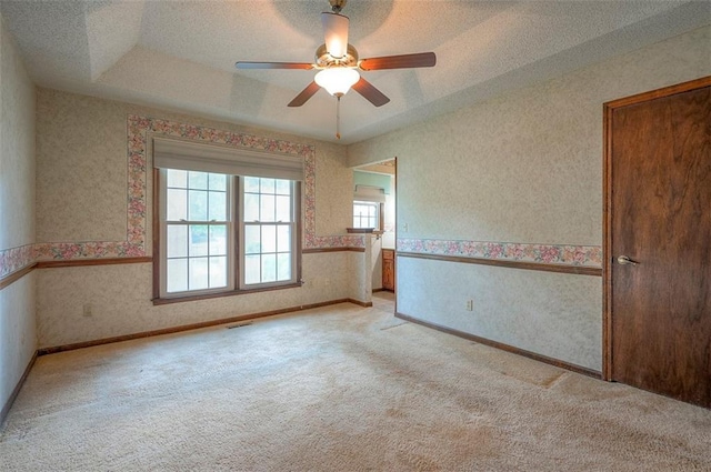 16327 W Locust St, Olathe, KS 66062 - carpeted spare room with wallpapered walls, a ceiling fan, and a textured ceiling