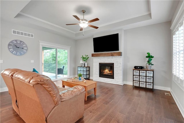 23103 W 125th Ter, Olathe, KS 66016 - living area featuring a tray ceiling, ceiling fan, healthy amount of natural light, and ornamental molding