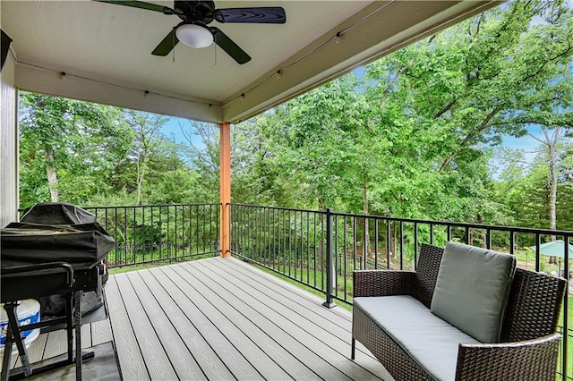 23103 W 125th Ter, Olathe, KS 66016 - deck with a ceiling fan and view of wooded area