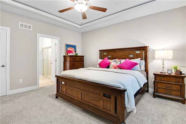 23103 W 125th Ter, Olathe, KS 66016 - bedroom with light colored carpet, ceiling fan, ensuite bathroom, and a raised ceiling