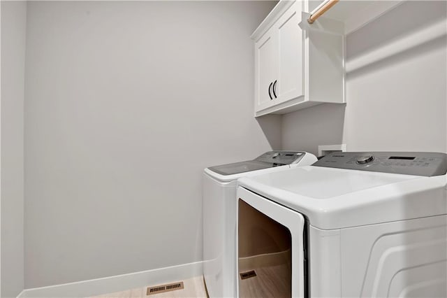 23103 W 125th Ter, Olathe, KS 66016 - laundry area featuring separate washer and dryer and cabinet space