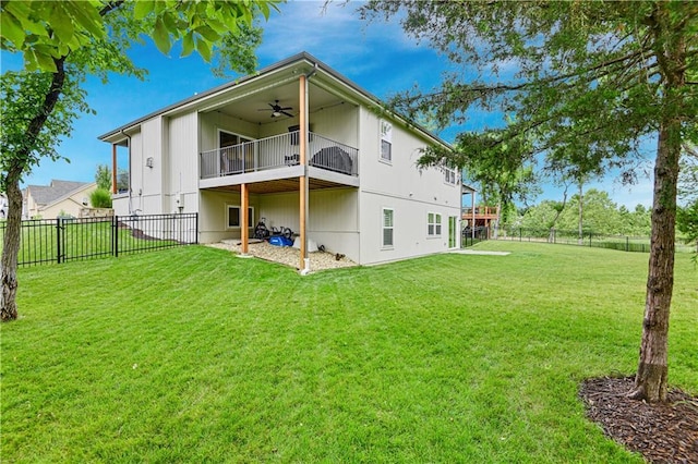 23103 W 125th Ter, Olathe, KS 66016 - rear view of house with a ceiling fan, a fenced backyard, and a balcony