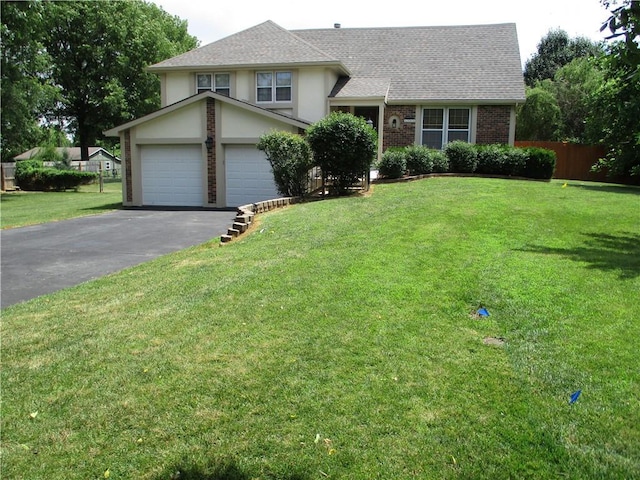 8265 Gleason Rd, Lenexa, KS 66227 - split level home featuring driveway, roof with shingles, an attached garage, brick siding, and stucco siding