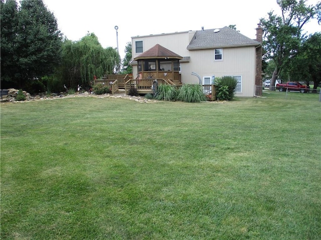 8265 Gleason Rd, Lenexa, KS 66227 - view of green lawn with a deck