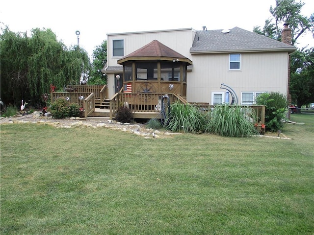 8265 Gleason Rd, Lenexa, KS 66227 - back of house with a deck, a chimney, and roof with shingles