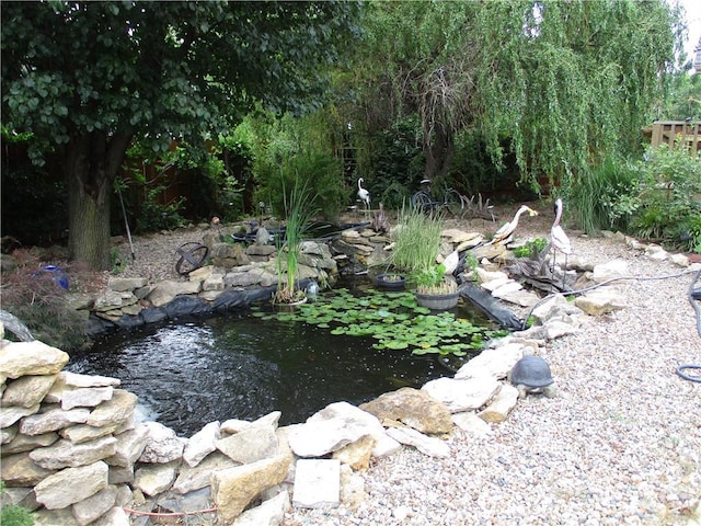 8265 Gleason Rd, Lenexa, KS 66227 - view of yard featuring a small pond