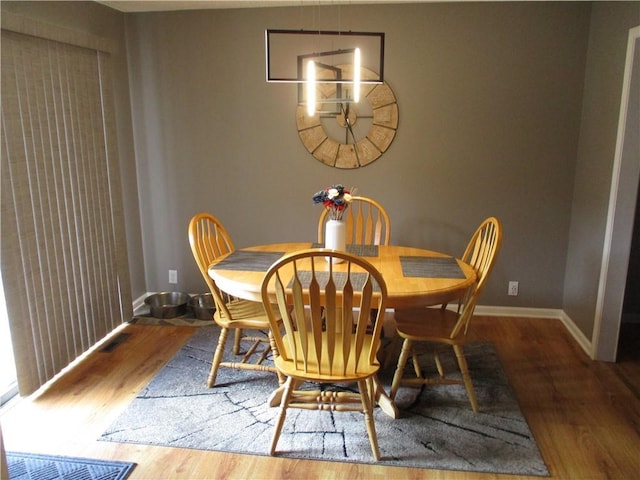 8265 Gleason Rd, Lenexa, KS 66227 - dining room with wood finished floors