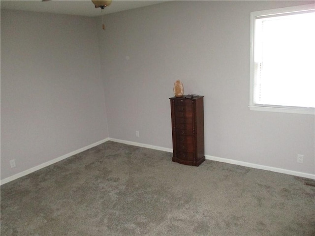 8265 Gleason Rd, Lenexa, KS 66227 - carpeted spare room with baseboards