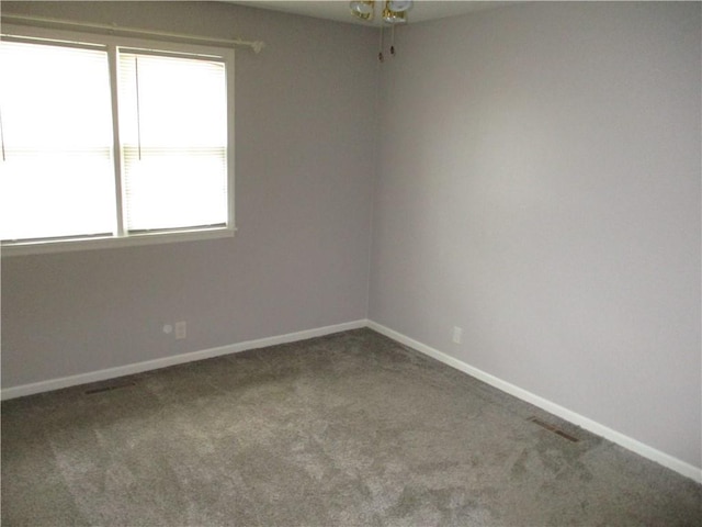 8265 Gleason Rd, Lenexa, KS 66227 - spare room featuring carpet floors and a ceiling fan
