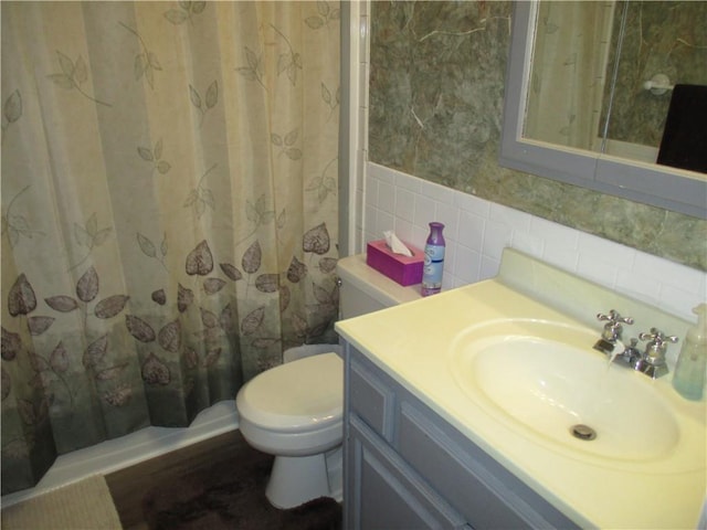 8265 Gleason Rd, Lenexa, KS 66227 - full bath with tile walls, vanity, and a shower with shower curtain