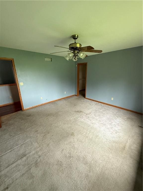 1011 N Arrowhead Dr, Burlington, KS 66839 - unfurnished room with a ceiling fan and light colored carpet