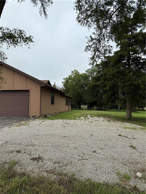 1011 N Arrowhead Dr, Burlington, KS 66839 - view of property exterior featuring an attached garage and driveway