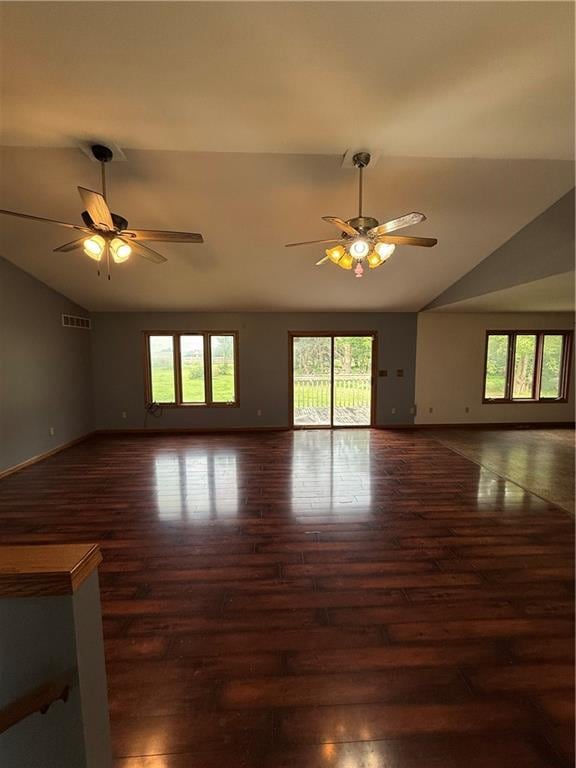 1011 N Arrowhead Dr, Burlington, KS 66839 - unfurnished living room with vaulted ceiling, a ceiling fan, and wood finished floors